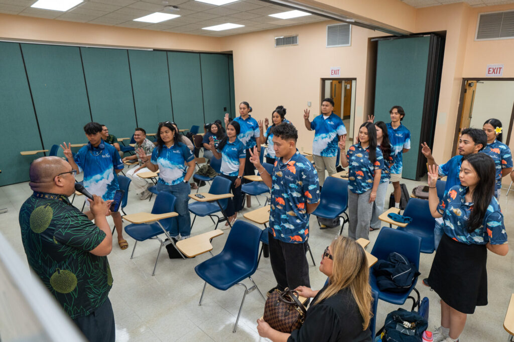 Kyle Mandapat, MBA, associate director for communications and community engagement at the University of Guam Center for Island Sustainability and Sea Grant, leads the pledging of participation by the 15 new fellows of the 2025 Research Education and Extension Fellowship (REEF) program at the UOG Robert F. Kennedy Library on Thursday, Oct. 2. The UOG Center for Island Sustainability and Sea Grant launched the new undergraduate internship program to expand opportunities for students from non-STEM (science, technology, engineering, and mathematics) disciplines.