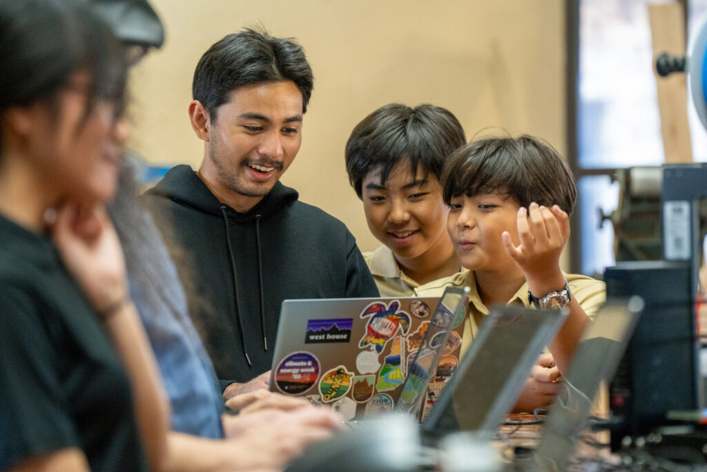 UOG Center for Island Sustainability and Sea Grant Research Education and Extension Fellow Napu Blas assists during the workshop at the G3 Makerspace.  The 3D printing workshop welcomed participants from many age groups including students and local makers.
