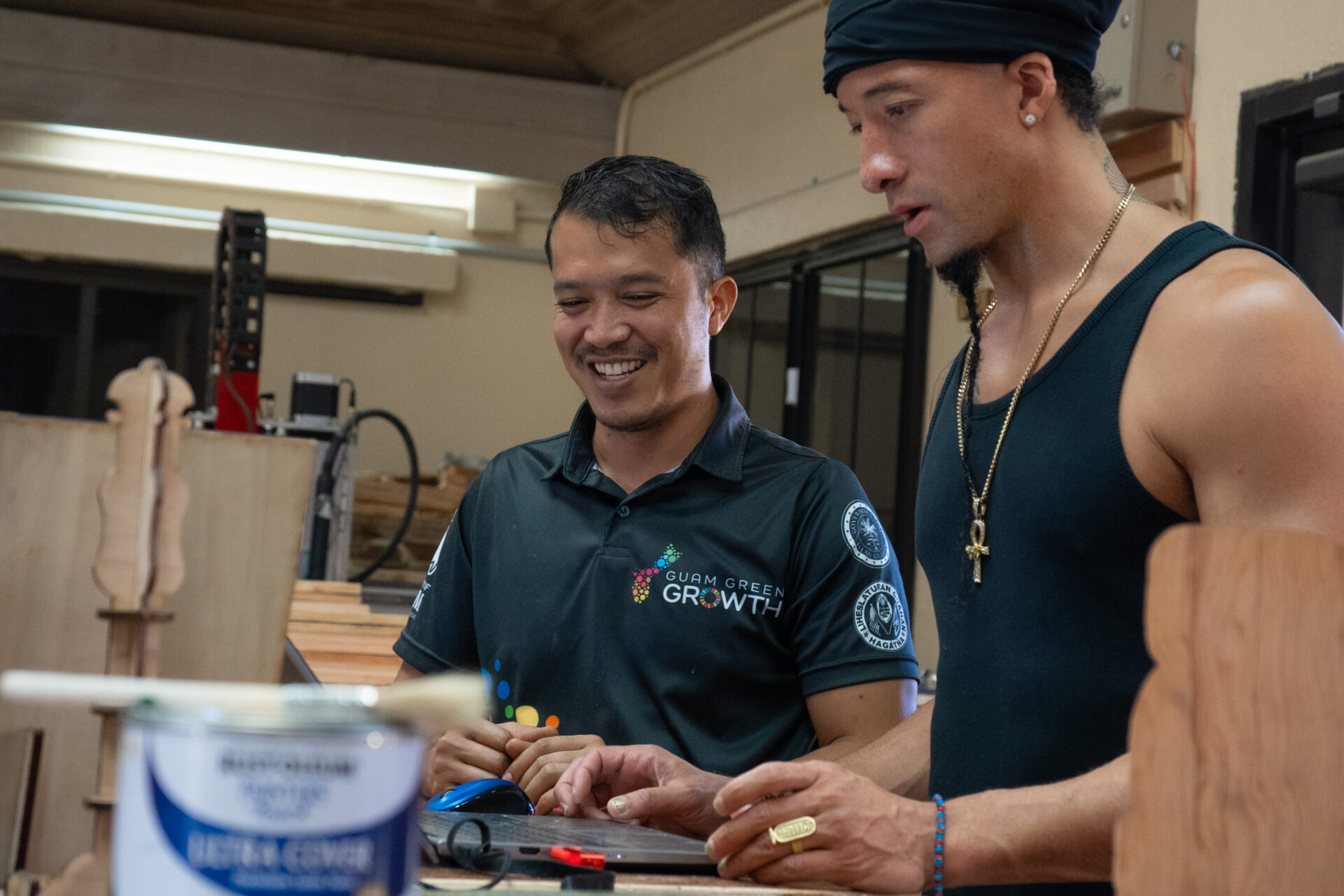 Guam Green Growth Circular Economy Makerspace and Innovation Hub technician Justin Cruz works with attendees of a laser engraver workshop at the CHamoru Village campus.  The group will host another laser engraver workshop to close out October’s training schedule.