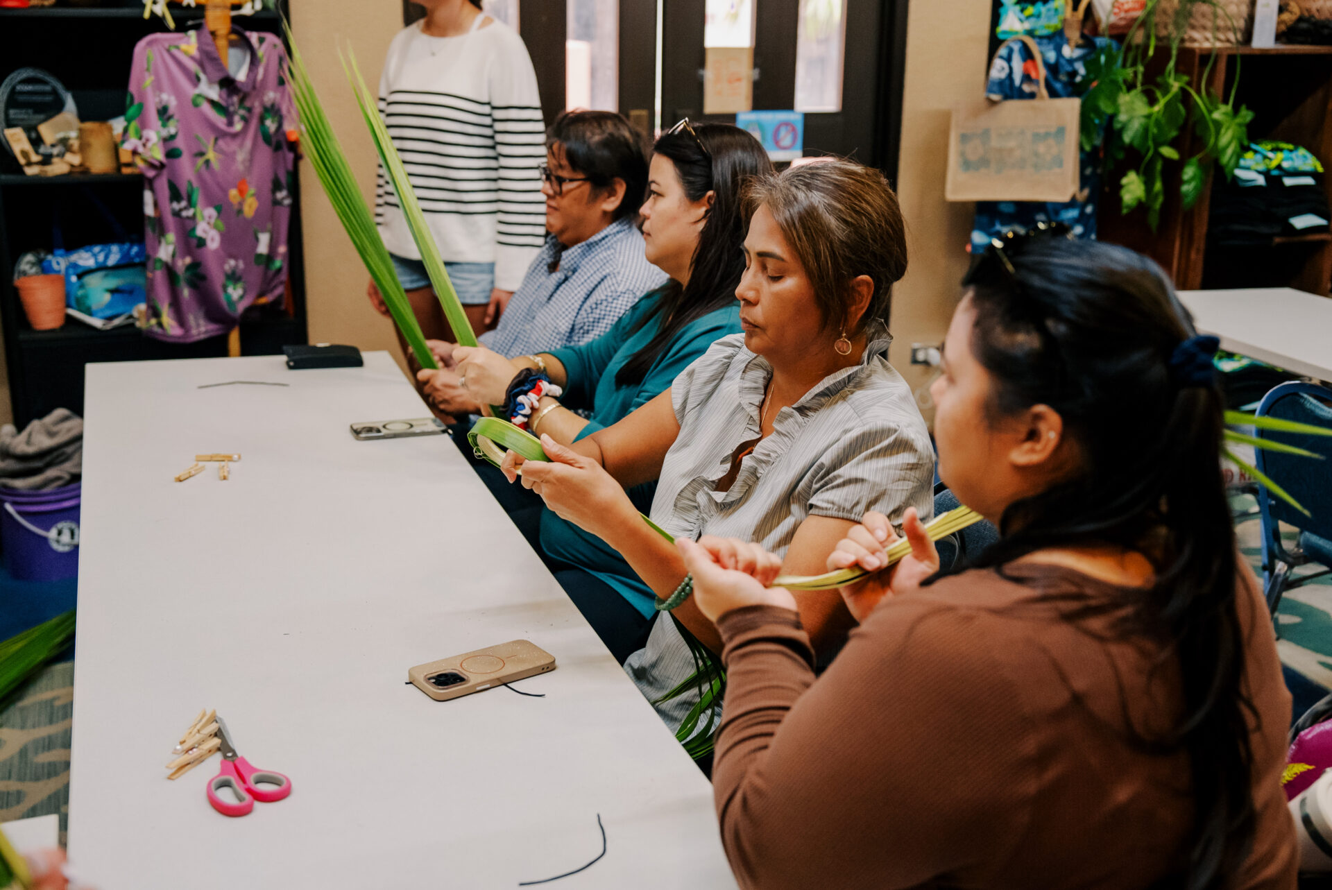 Participants in a weaving workshop at the Guam Green Growth Circular Economy Makerspace and Innovation Hub learn the CHamoru skills of creation with the coconut leaves.  A katupat weaving workshop, complete with celebratory kadu, will be help this month at the CHamoru Village campus. 