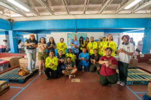 Guam Green Growth Conservation Corps members and volunteers pose with relief supplies at LBJ Elementary School during a Super Typhoon Sinlaku donation drive.