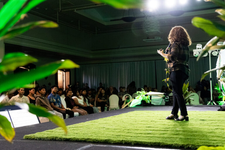 A speaker at CIS2025's Seed Talks addressing a crowd.