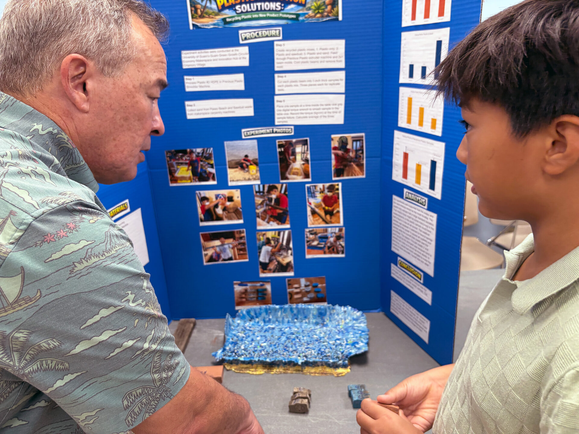 Delegate to Congress, James Moylan with a science fair participant.