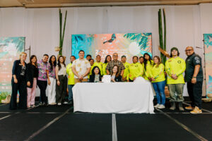 Leaders and representatives from Green Growth movements across Micronesia and Hawaiʻi pose with a signed document at the 17th UOG Conference on Island Sustainability.