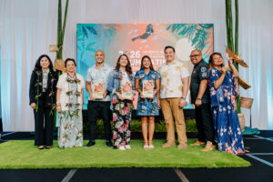 Speakers and community members pose with awards on stage during the CIS2026 SEED Talks at the 17th UOG Conference on Island Sustainability.