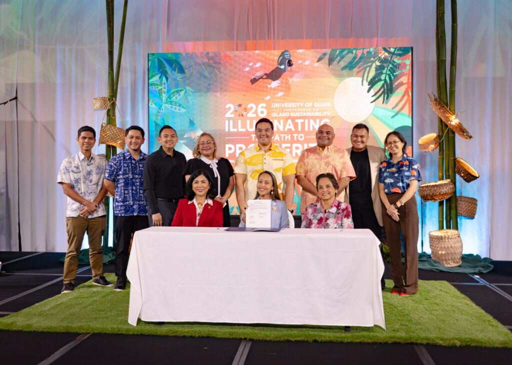 Officials from GVB, UOG, and the Guam government pose for a group photo during an MOU signing ceremony at the 2026 Conference on Island Sustainability.